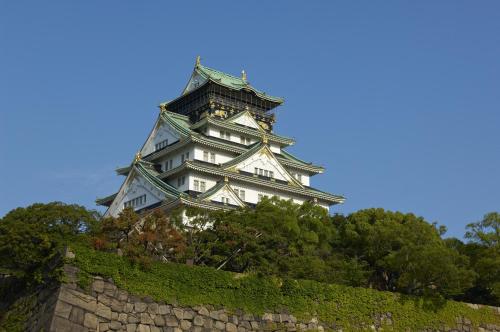 a tall white tower sitting on top of a wall at Hotel Osaka Castle in Osaka