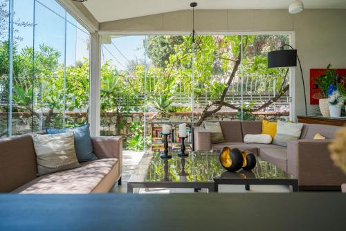 a living room with a couch and a table at Hotel Rivage Taormina in Taormina