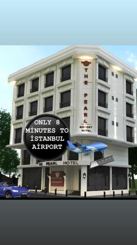 a white building with a sign in front of it at The Pearl Airport Hotel in Arnavutköy