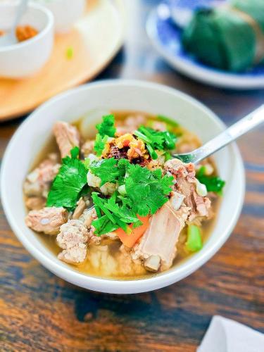 a bowl of soup with meat and greens in it at J Park Pakchong in Ban Sao Thong