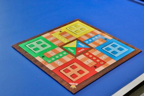 a game board on top of a blue table at Dolce Villa IGATPURI in Igatpuri