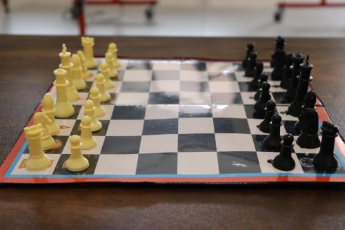 a chess board with chess pieces on a table at Dolce Villa IGATPURI in Igatpuri