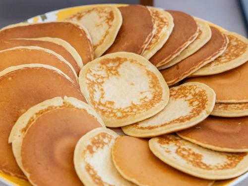 a pile of pancakes sitting on top of a plate at Novotel Suites Montpellier Antigone in Montpellier