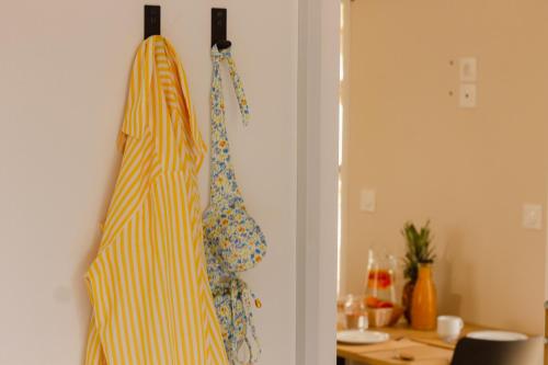 a room with two apron hanging on a wall at TAIGA Almeria Playa in Palomares