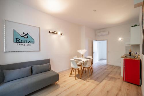 a living room with a couch and a table at Renzo & Lucia Living Lake in Malgrate