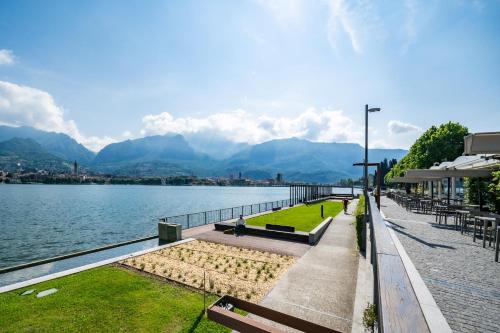 a view of a lake with mountains in the background at Renzo & Lucia Living Lake in Malgrate