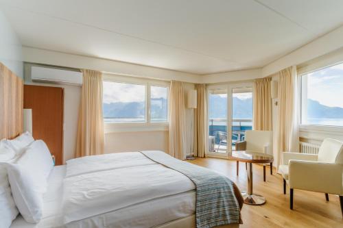 Postel nebo postele na pokoji v ubytování Hotel Mona