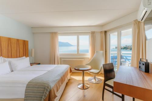 Postel nebo postele na pokoji v ubytování Hotel Mona