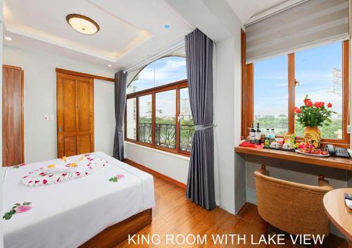 Ένα ή περισσότερα κρεβάτια σε δωμάτιο στο Hanoi Old Quarter Hotel