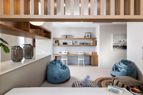 a living room with blue bean bags and a table at The Indiana - A Space to Relax in Dunsborough
