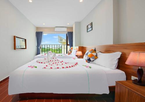 Ένα ή περισσότερα κρεβάτια σε δωμάτιο στο Hanoi Old Quarter Hotel