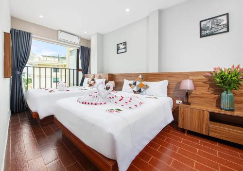Ένα ή περισσότερα κρεβάτια σε δωμάτιο στο Hanoi Old Quarter Hotel