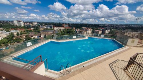 a large swimming pool on top of a building at Serenity Retreat - 2 Bed Apartment with Pool & Gym in Nairobi