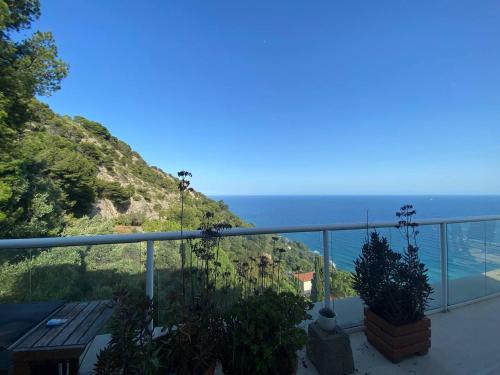 a view of the ocean from the balcony of a house at Attico sul mare in Grimaldi