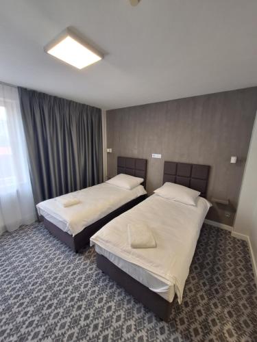 Una cama o camas en una habitación de Hotel Gordon