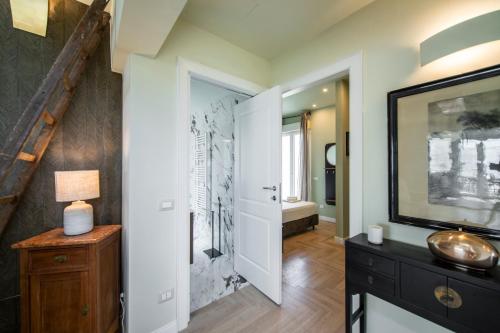a bathroom with a walk in shower and a sink at Penthouse with Terrace over Florence in Florence