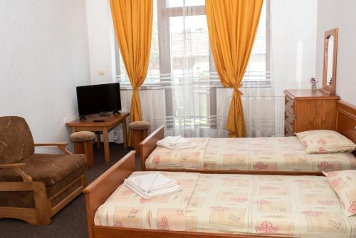 Cama o camas de una habitación en Комплекс Плавис
