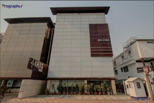 a building with people standing in front of it at Iris Park Hotel New Delhi in New Delhi