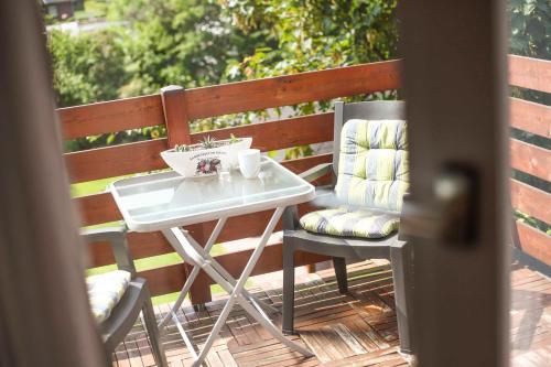 a table and two chairs on a patio at Ferienwohnung Werner in Jork