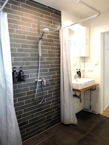 a bathroom with a shower and a sink at Stilvoll, Zentral, Einzigartig I Balkon I Parkplatz I Küche in Paderborn