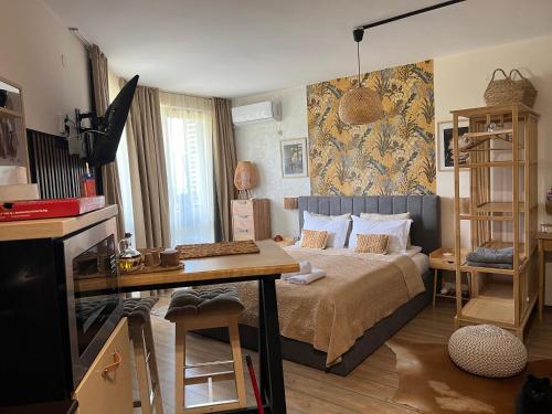 Μια τηλεόραση ή/και κέντρο ψυχαγωγίας στο Luxury Studio in Alpinе Lodge FREE SPA