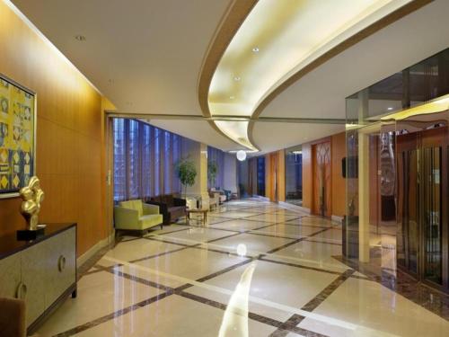 a lobby of a building with a lobby at Putian Depo Hotel in Putian
