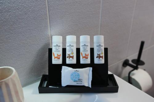a gift box with four products on a table at CASTLE VIEW luxury apartment with Free Private Parking in Kavala