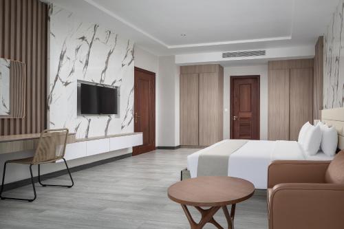 RIVA Hotel SHVにあるテレビまたはエンターテインメントセンター