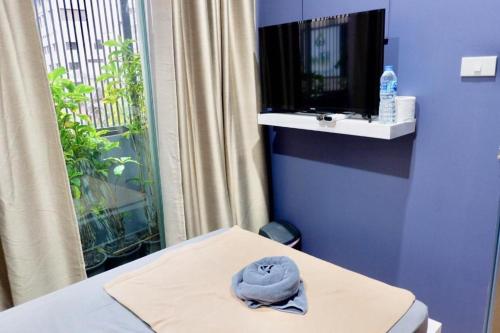 a hat sitting on a table in a room at Sleep cafe @ Hidee in Bangkok