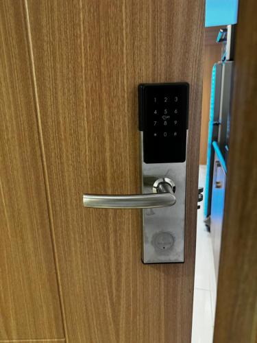 a close up of a door with a handle at Makati apartment - Lush Residences in Manila