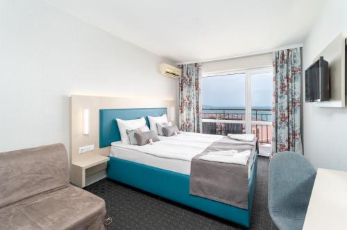 Postel nebo postele na pokoji v ubytování MPM Hotel Orel - Ultra All Inclusive