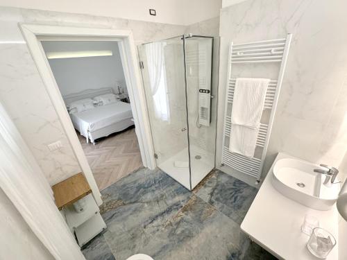 a bathroom with a shower and a sink at Adagio Salentino in Porto Cesareo