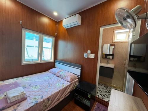 Postel nebo postele na pokoji v ubytování An Chi Hotel