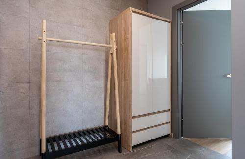 a room with a glass door next to a wall at 05 Gdynia Premium - Apartament Mieszkanie dla 6 osób in Gdynia