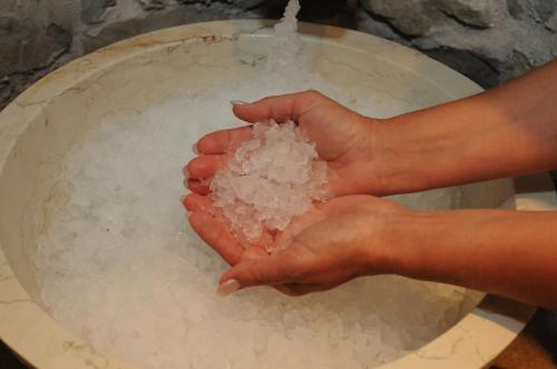 a person holding a ball of snow in their hands at Hotel Olaga in Valdaora