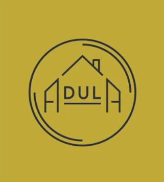 a house logo is shown on a yellow background at Adula - pokoje i apartamenty in Janów Lubelski