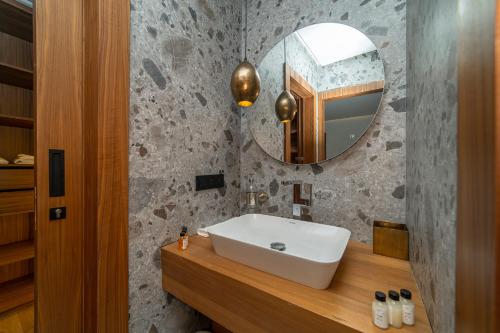 a bathroom with a sink and a mirror at Villa Marrakech vue atlas in Marrakech