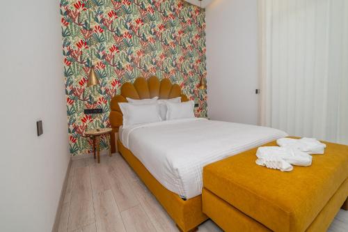 a hotel room with a bed with towels on a table at Villa Marrakech vue atlas in Marrakech
