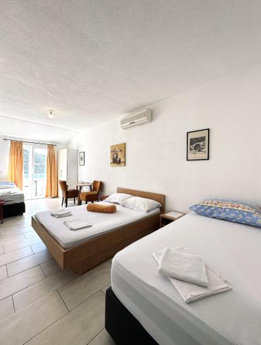 Postel nebo postele na pokoji v ubytování Apartments Mango