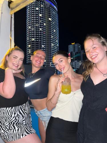 a group of women posing for a picture at a party at Bondi Backpackers Nhatrang in Nha Trang