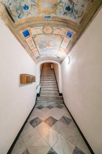 a hallway with a painting on the ceiling of a building at La Brignoletta Le Case del Dria Acquario suite in Genova