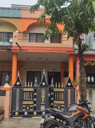 a motorcycle parked in front of a building at Shivalaya Homestay in Nashik