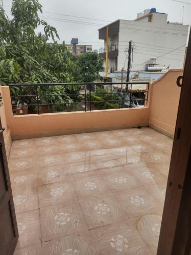 an open door to a balcony with a tile floor at Shivalaya Homestay in Nashik