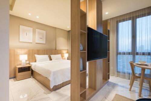 Voodi või voodid majutusasutuse The Code Residence - ذا كود ريزيدنس toas