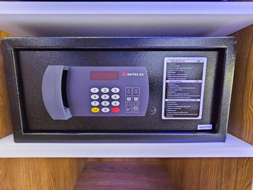 a microwave oven sitting on top of a shelf at AKTEON GIRNI in Paralia Katerinis