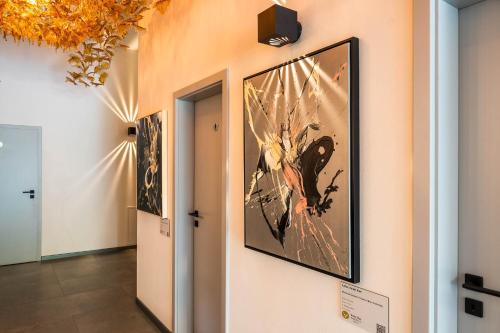 a large painting on a wall in a hallway at Veltlin Bed & Wine in Valtice