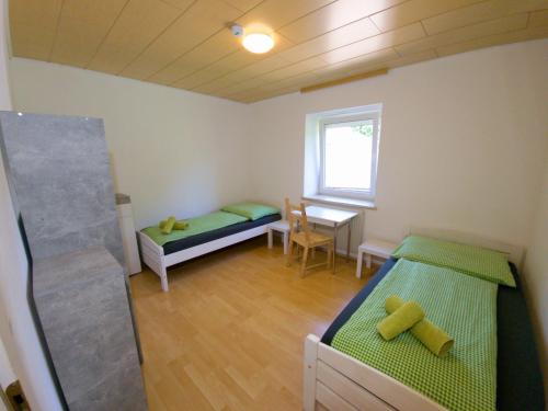 Ένα ή περισσότερα κρεβάτια σε δωμάτιο στο Apartments in Grüner Umgebung