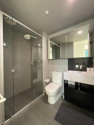 a bathroom with a toilet and a shower and a sink at C&S Stay- Melbourne CBD in Melbourne
