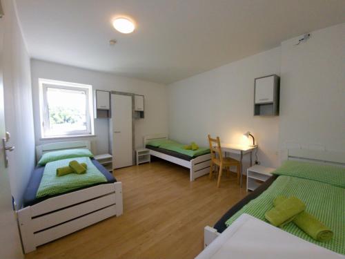 Posteľ alebo postele v izbe v ubytovaní Apartments in Grüner Umgebung