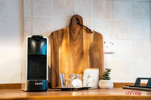 a coffee maker sitting on top of a counter at Charming Historic Home with Rooftop Views in Senglea